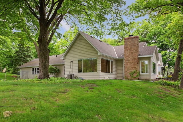6 Shore Rd, North Oaks, MN 55127 - view of front of property with a chimney, a front yard, and a shingled roof