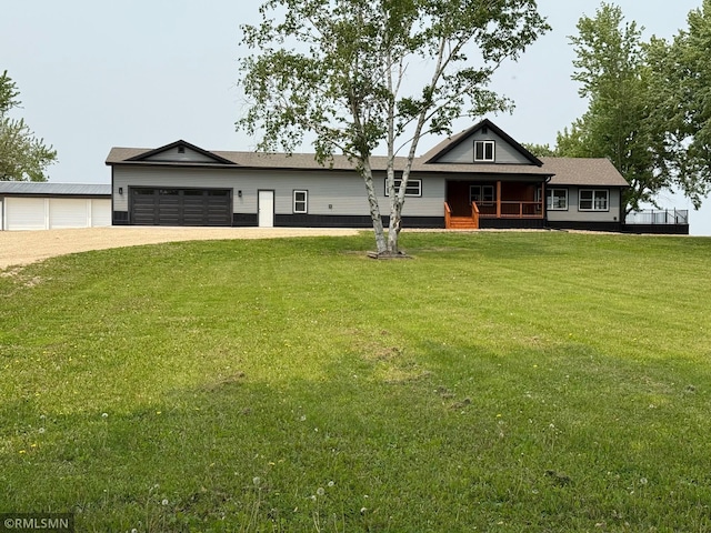 1616 130th Ave, Erin Prairie Twp, WI 54017 - view of front facade with dirt driveway, covered porch, a front lawn, and an attached garage