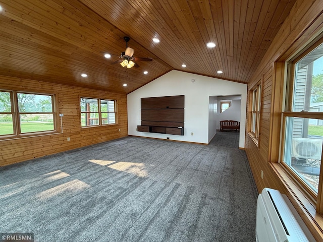 1616 130th Ave, Erin Prairie Twp, WI 54017 - unfurnished living room featuring carpet floors, wood ceiling, vaulted ceiling, a wall mounted AC, and wood walls