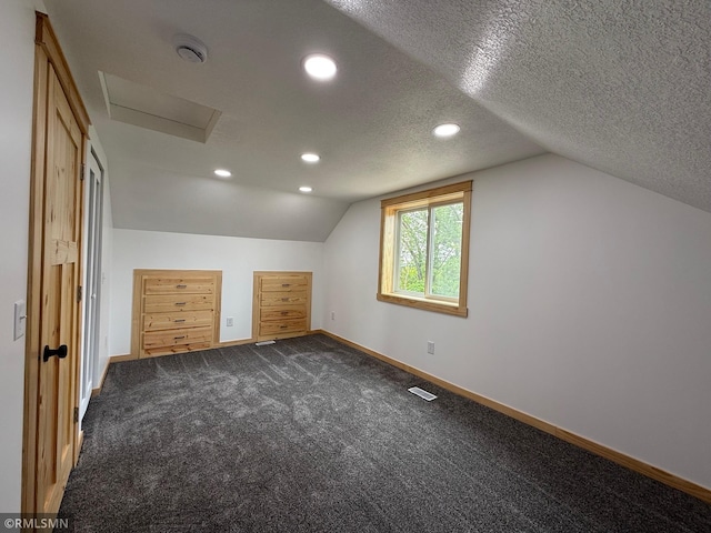 1616 130th Ave, Erin Prairie Twp, WI 54017 - bonus room featuring baseboards, vaulted ceiling, attic access, dark colored carpet, and recessed lighting
