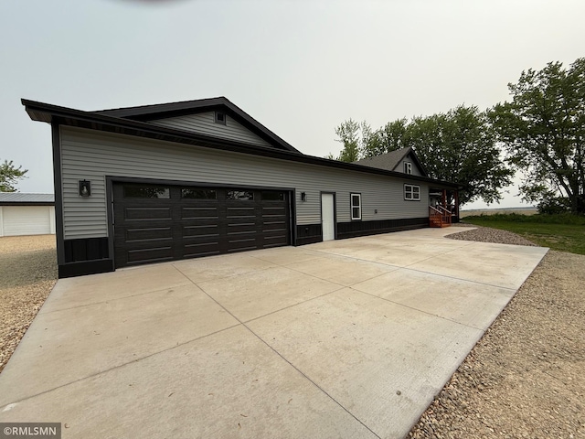 1616 130th Ave, Erin Prairie Twp, WI 54017 - view of side of home featuring driveway and a garage