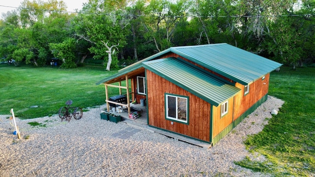 13739 429th Ave, Webster, SD 57274 - view of side of home featuring a lawn and metal roof