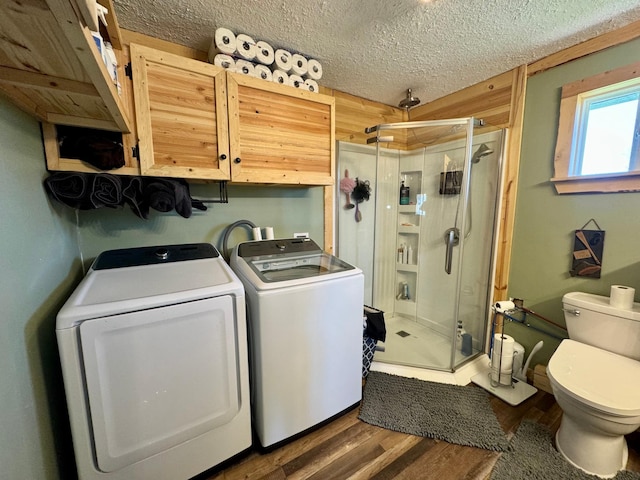 13739 429th Ave, Webster, SD 57274 - laundry room with washing machine and clothes dryer, wood finished floors, and a textured ceiling