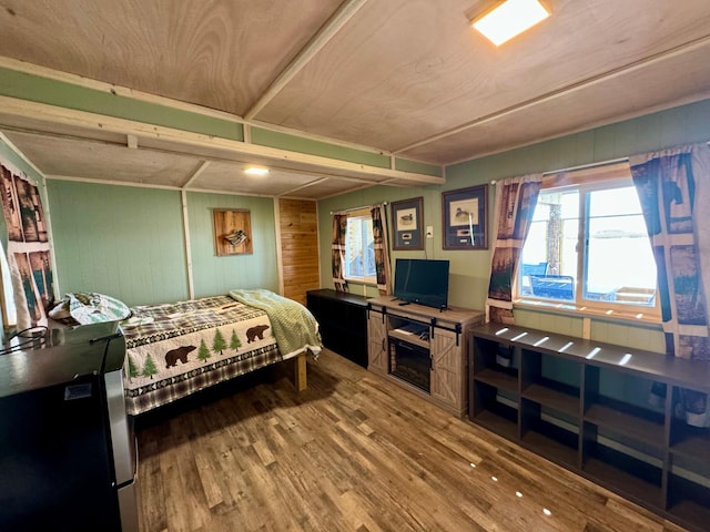 13739 429th Ave, Webster, SD 57274 - bedroom featuring wood finished floors and wooden walls