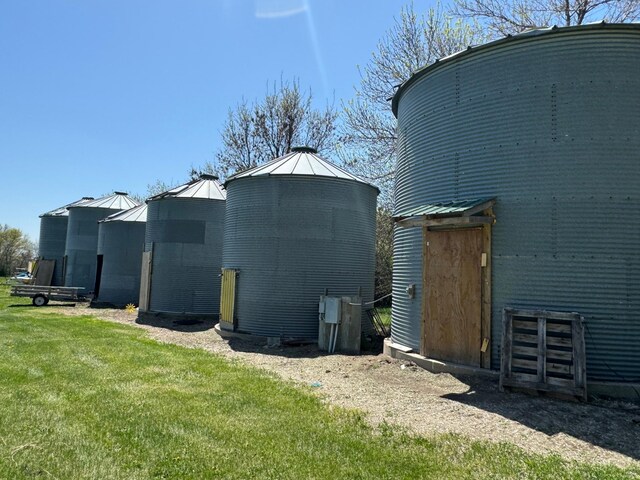 13739 429th Ave, Webster, SD 57274 - view of side of home featuring a standing seam roof, a yard, and metal roof