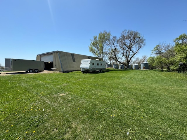 13739 429th Ave, Webster, SD 57274 - view of grassy yard featuring a detached garage, an outdoor structure, and an outbuilding