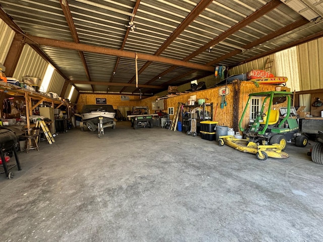 13739 429th Ave, Webster, SD 57274 - garage featuring metal wall and a workshop area