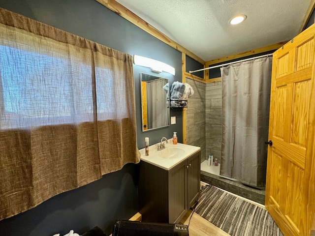 13739 429th Ave, Webster, SD 57274 - bathroom featuring a shower with curtain, a textured ceiling, and vanity