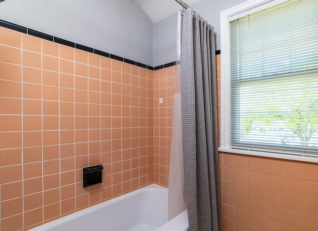bathroom featuring shower / bath combination with curtain