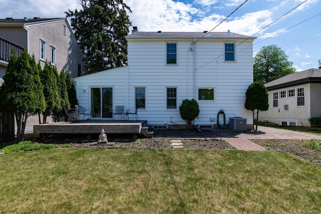 back of house with a wooden deck, a yard, and central air condition unit