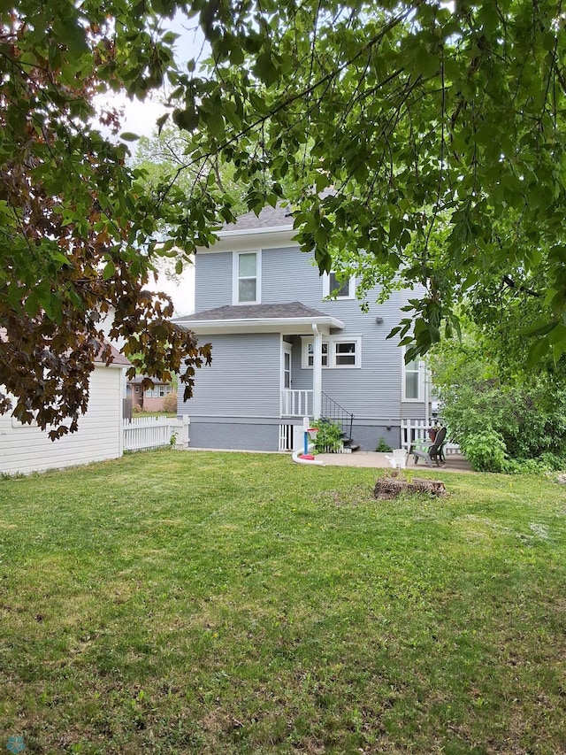back of house with a yard
