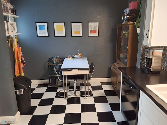 dining area featuring tile patterned floors and baseboards