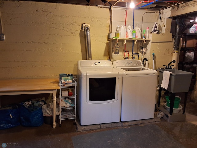 laundry area with separate washer and dryer