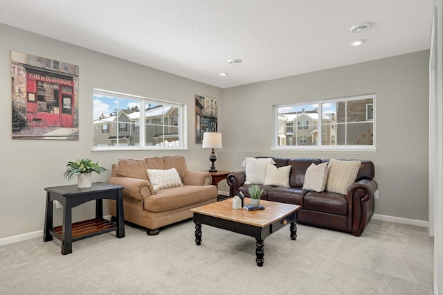 819 Roselyn Dr, Victoria, MN 55386 - living room featuring healthy amount of natural light, light colored carpet, baseboards, and recessed lighting