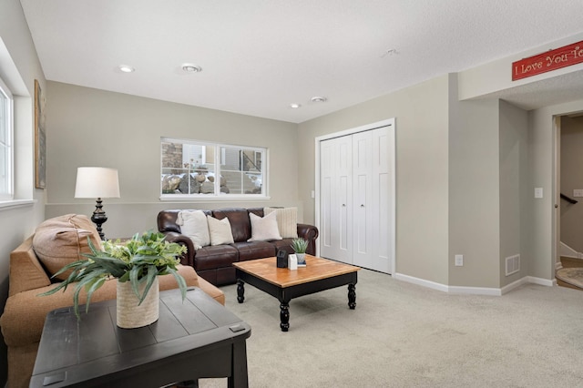 819 Roselyn Dr, Victoria, MN 55386 - living room featuring light colored carpet, baseboards, and recessed lighting
