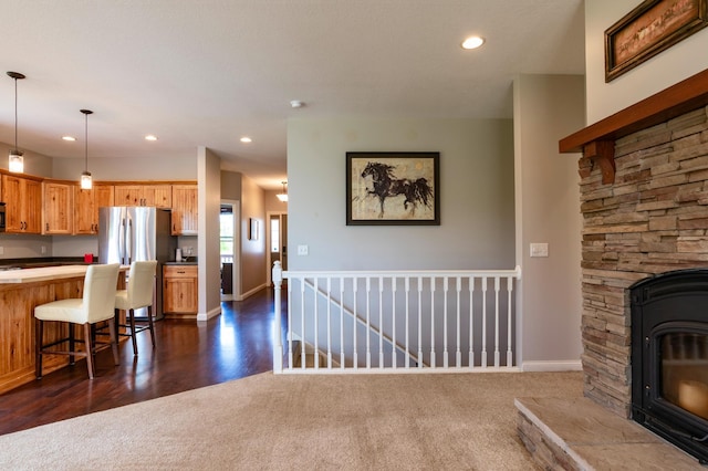 721 Quail Pkwy, Watertown, MN 55388 - living area featuring recessed lighting, baseboards, dark colored carpet, and dark wood-style floors