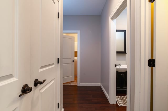 721 Quail Pkwy, Watertown, MN 55388 - corridor with dark wood-style floors, a sink, and baseboards