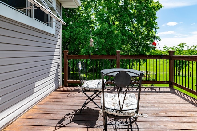 721 Quail Pkwy, Watertown, MN 55388 - wooden terrace with outdoor dining space
