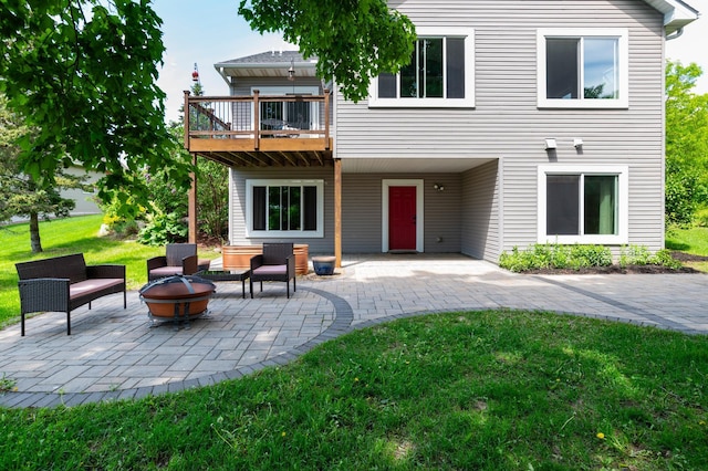 721 Quail Pkwy, Watertown, MN 55388 - rear view of house with a fire pit, a yard, and a patio