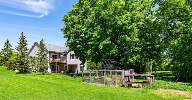 721 Quail Pkwy, Watertown, MN 55388 - view of grassy yard featuring a garden and a balcony