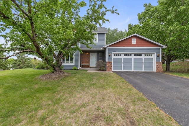 4180 Reading Rd, Eagan, MN 55123 - view of front facade featuring driveway, a garage, brick siding, and a front lawn