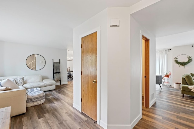 4180 Reading Rd, Eagan, MN 55123 - living area with wood finished floors, a chandelier, and baseboards