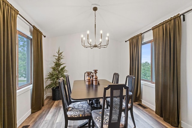 4180 Reading Rd, Eagan, MN 55123 - dining space featuring a chandelier, plenty of natural light, baseboards, and vaulted ceiling