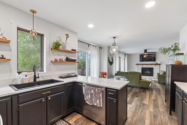 4180 Reading Rd, Eagan, MN 55123 - kitchen with open shelves, a sink, a stone fireplace, dishwasher, and recessed lighting