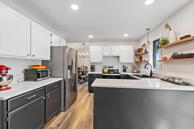4180 Reading Rd, Eagan, MN 55123 - kitchen with a sink, appliances with stainless steel finishes, white cabinets, open shelves, and a peninsula