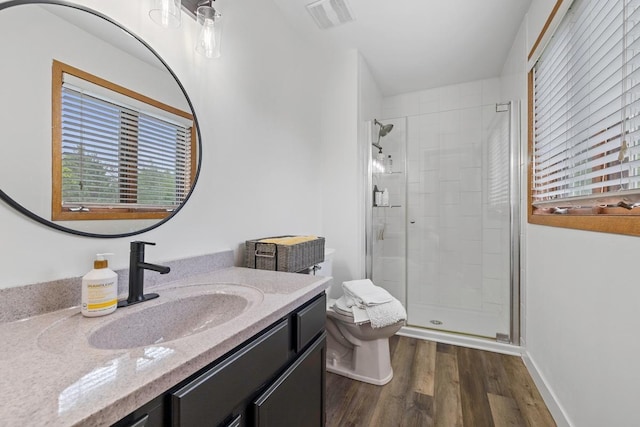 4180 Reading Rd, Eagan, MN 55123 - bathroom featuring a shower stall, toilet, wood finished floors, and healthy amount of natural light