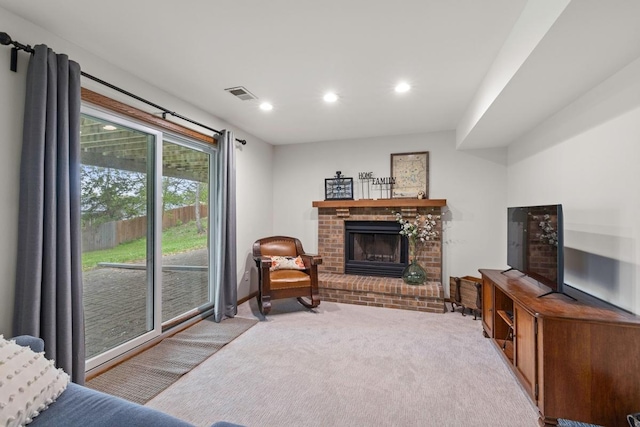 4180 Reading Rd, Eagan, MN 55123 - carpeted living area with a brick fireplace and recessed lighting