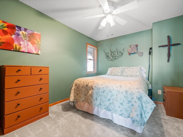 28604 Shore Dr, Starbuck, MN 56381 - carpeted bedroom featuring baseboards, a textured ceiling, and ceiling fan