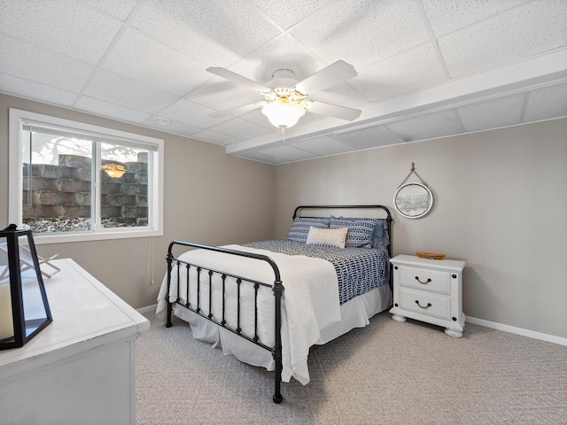 28604 Shore Dr, Starbuck, MN 56381 - bedroom featuring light colored carpet, baseboards, a ceiling fan, and a paneled ceiling