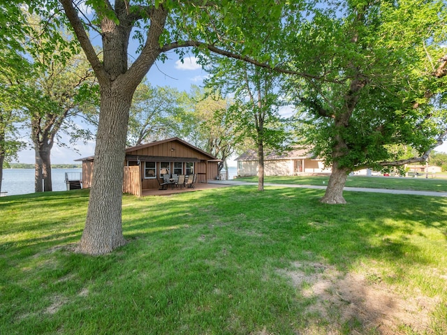 28604 Shore Dr, Starbuck, MN 56381 - view of green lawn with a water view and a patio