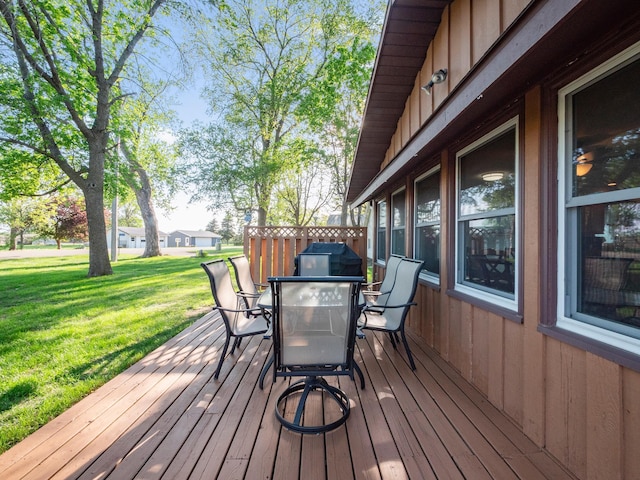 28604 Shore Dr, Starbuck, MN 56381 - wooden terrace featuring outdoor dining area and a yard