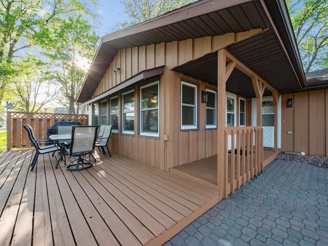 28604 Shore Dr, Starbuck, MN 56381 - wooden terrace featuring outdoor dining space
