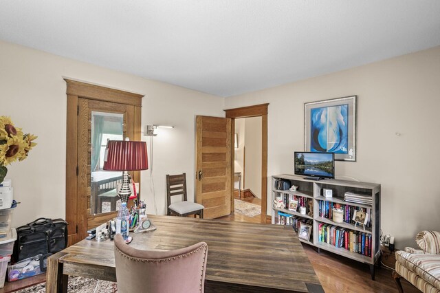 home office with wood finished floors