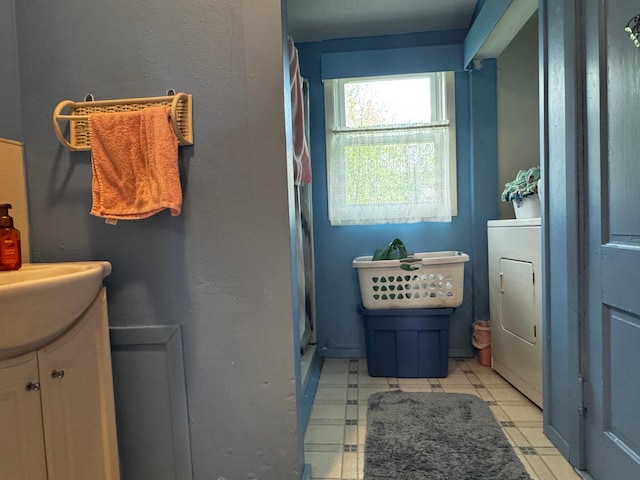 208 Cush St, Jackson, MN 56143 - full bathroom featuring washer / clothes dryer, vanity, a shower, and tile patterned floors