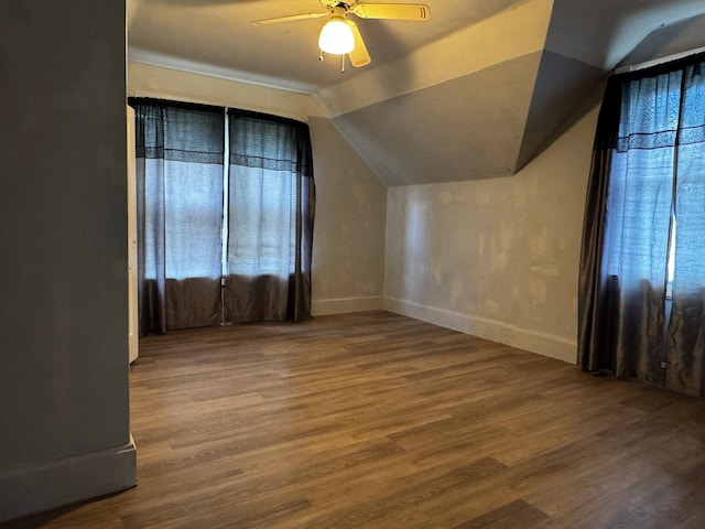 208 Cush St, Jackson, MN 56143 - bonus room with a ceiling fan, wood finished floors, vaulted ceiling, and baseboards