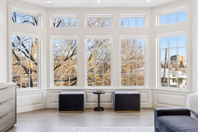 1301 Mount Curve Ave, Minneapolis, MN 55403 - sitting room with plenty of natural light, wood finished floors, a decorative wall, a towering ceiling, and recessed lighting