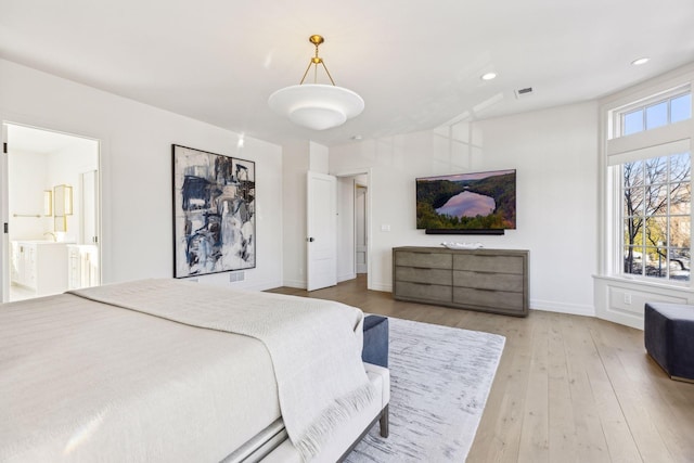 1301 Mount Curve Ave, Minneapolis, MN 55403 - bedroom with light wood-style flooring, baseboards, recessed lighting, and ensuite bath