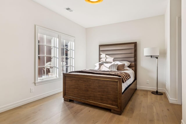 1301 Mount Curve Ave, Minneapolis, MN 55403 - bedroom with baseboards and light wood finished floors