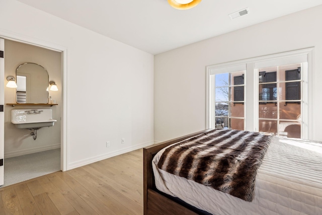 1301 Mount Curve Ave, Minneapolis, MN 55403 - bedroom featuring light wood-style floors and baseboards