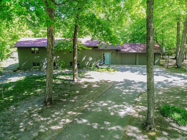 2536 Sandhill Ln NE, Carlos Twp, MN 56308 - rear view of property featuring a garage, driveway, and a shingled roof