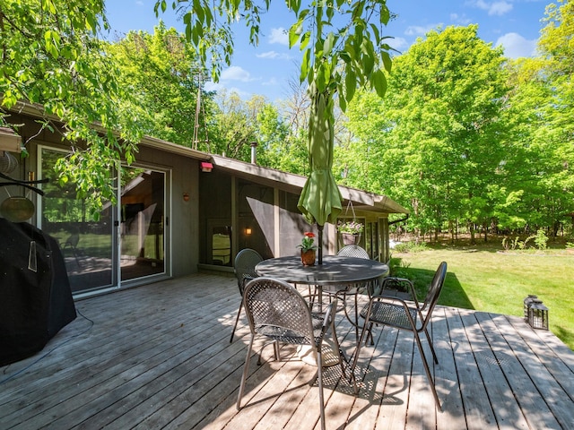 2536 Sandhill Ln NE, Carlos Twp, MN 56308 - wooden terrace with a yard, outdoor dining area, and a grill