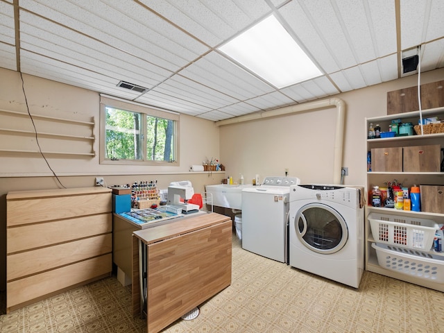 2536 Sandhill Ln NE, Carlos Twp, MN 56308 - laundry area with independent washer and dryer and tile patterned floors