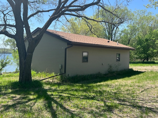34373 State Highway 7, Foster Twp, MN 56225 - view of side of home with a lawn and a shingled roof