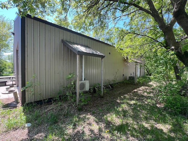 34373 State Highway 7, Foster Twp, MN 56225 - view of side of home featuring ac unit, board and batten siding, and central air condition unit