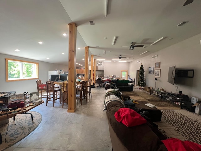 34373 State Highway 7, Foster Twp, MN 56225 - living area featuring concrete floors and a ceiling fan