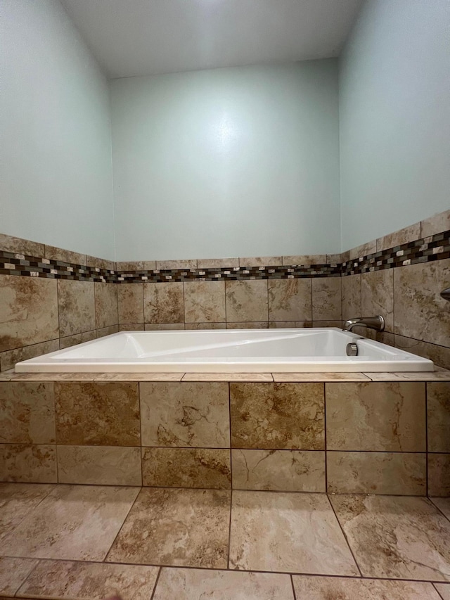 34373 State Highway 7, Foster Twp, MN 56225 - bathroom featuring a garden tub and tile walls